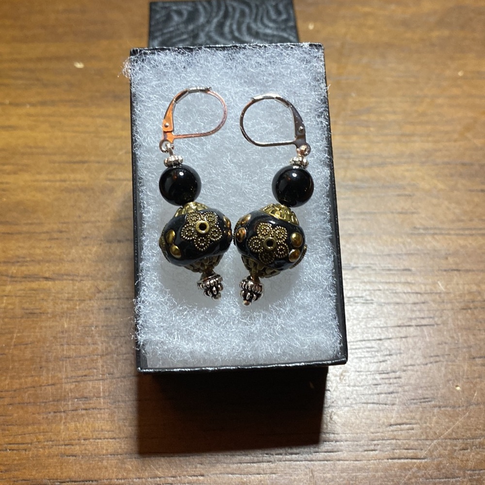 Silver Black, and gold tone earrings